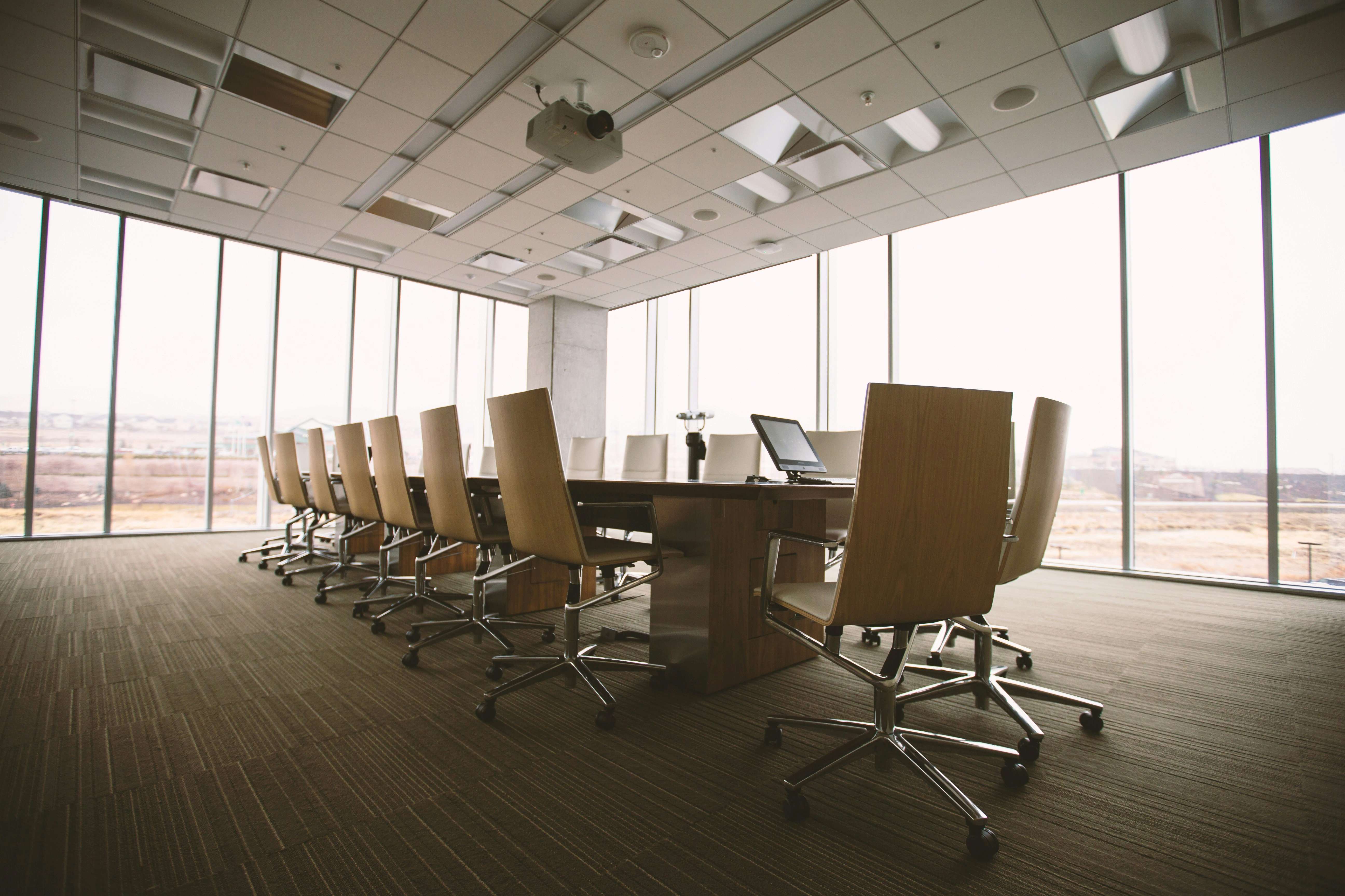 An empty boardroom at the moment before a consequential decision